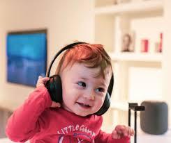 Small child wearing large over-ear headphones